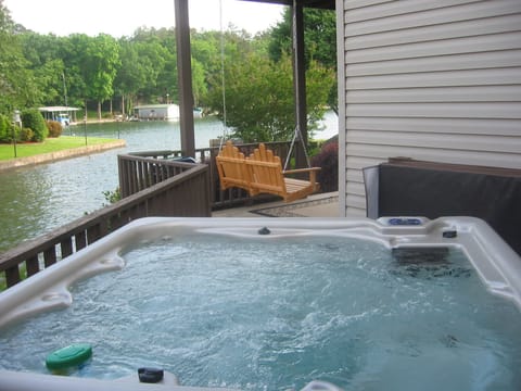 Enjoy the hot tub while looking at the tranquility of the lake. 