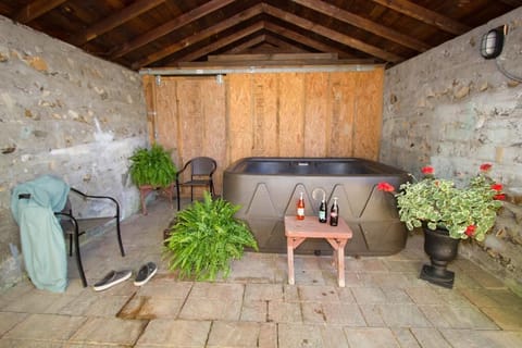 Sheltered outdoor hot tub, just steps from the back door.  Soak your cares away.