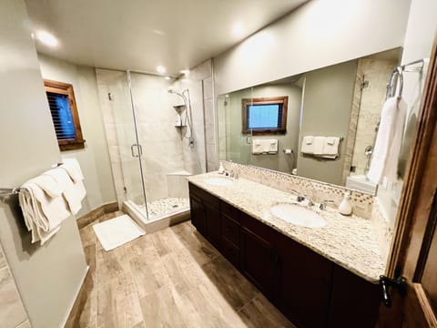 Combined shower/tub, rainfall showerhead, hair dryer, heated floors