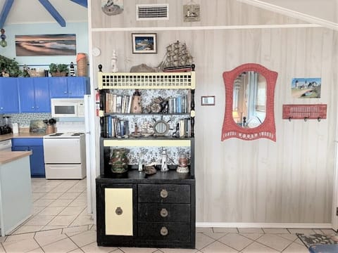 View of hutch with books and board games for those lazy beach afternoons!