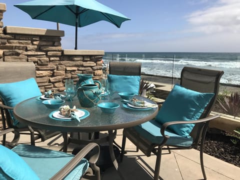 Luxury oceanfront patio, watch  dolphins jump while you have breakfast or dinner