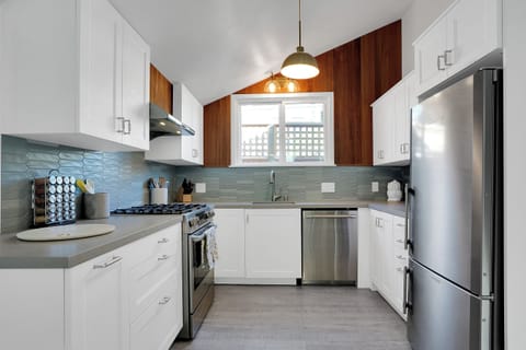 Recently remodeled kitchen with high-end appliances and connection to dining 