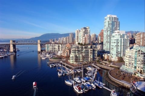 View from Granville bridge, building to the right side by marina & seawall walks