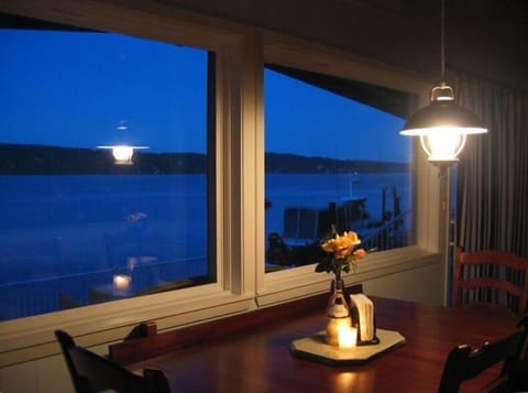 Enjoy romantic dinners with front seat ocean views...Seating for 8 at table!