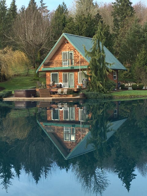 Reflection of the cabin in the pond.
