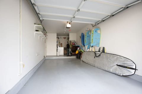 Garage w/alot Toys, surf board, boogie boards , umbrellas and chairs, stroller.