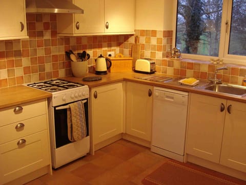 Separate, good sized, well equipped modern kitchen/breakfast overlooking field 