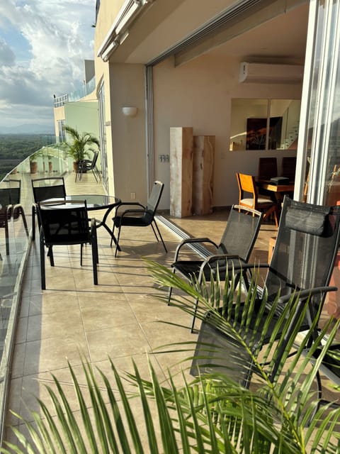 Spacious terrace running the length of the condo bringing the outside in.