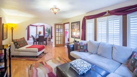 Living room with beautiful Plantation shutters and large comfortable seating