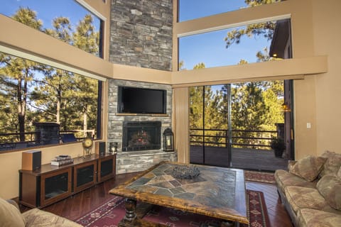 Main Living Room. Enjoy the comfy couches, warm fireplace and amazing views.