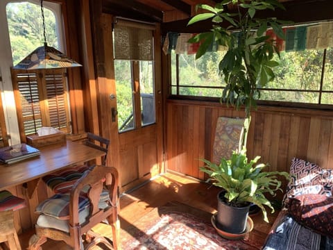 upstairs porchroom also acts as an inspiring writing station or office