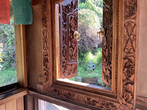 upstairs porchroom with Balinese window