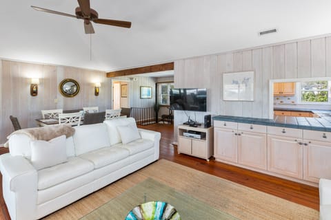 Living Room has a pass thru to the Kitchen and a Smart TV