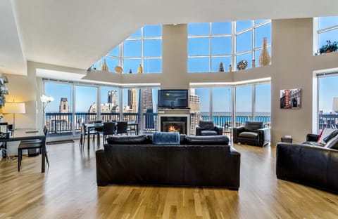2 story great room with gas fireplace and wrap around balcony and queen sleeper sofa.