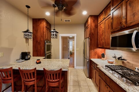 Enjoy breakfast or a snack at the kitchen bar.