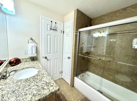 Combined shower/tub, hair dryer, towels, soap