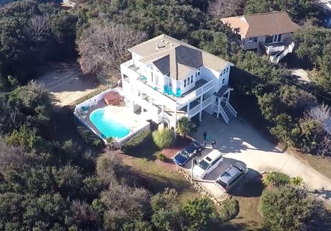 Aerial view of the DolphinInnOBX.  7 Bedroom house.  4 minute walk to beach