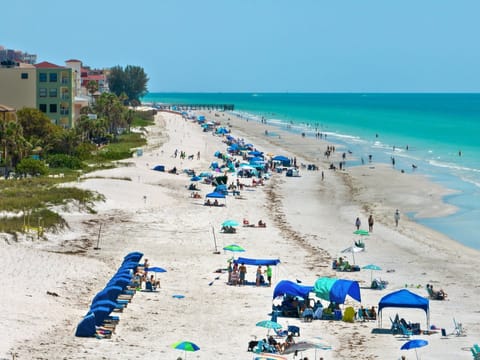 On the beach, sun loungers, beach towels