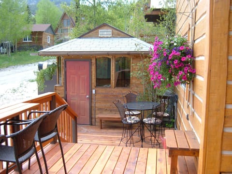 Enjoy the morning deck with coffee or a soak in the hot tub at Ski Town Condos.