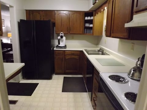 Kitchen is complete down to the dishes, pots & pans