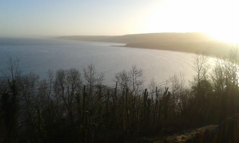 Have breakfast on the deck and watch the sun rise over the bay.