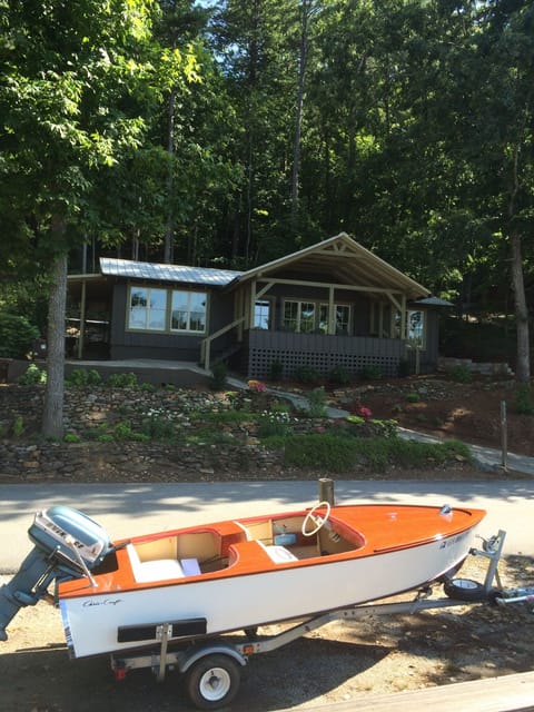 The cottage with our friend's wooden boat parked in front!