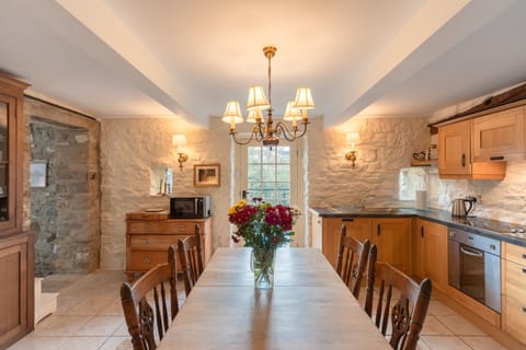 Our eat in kitchen. Dishwasher, fridge , washer behind cabinetry; stove/oven