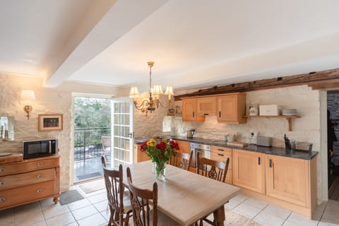 Our kitchen with the door to the balcony and the river
