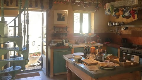 Family Room with kitchen, and large double doors accessing the garden.