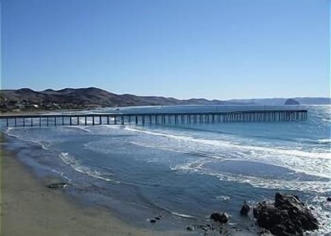 View of Cayucos Pier from condo deck. Morro Rock can be seen in the background.