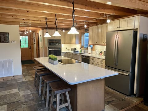 Enjoy cooking in fully equipped kitchen with large island eat-in bar!