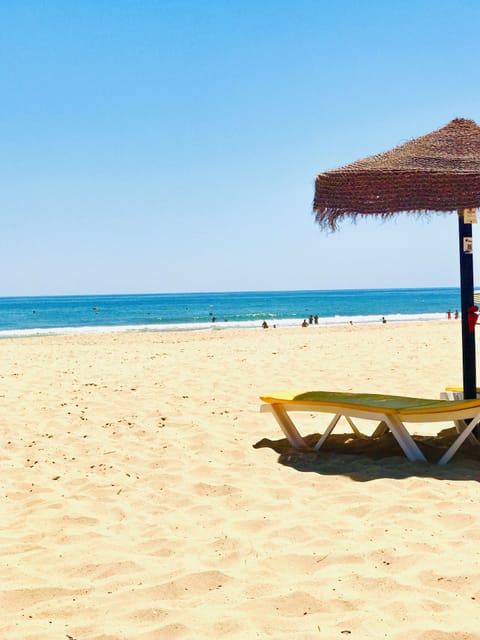 On the beach, sun loungers