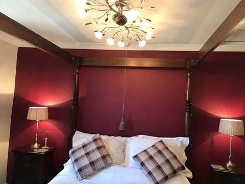 Upstairs bedroom with 4 poster bed.