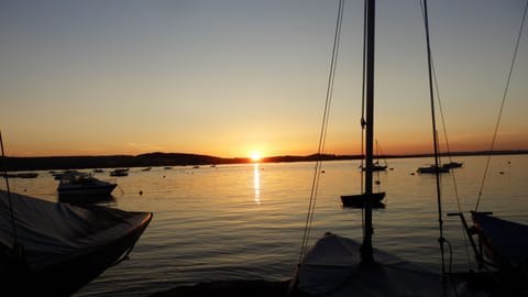 THE SUN GOING DOWN OVER THE RIVER