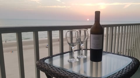 Enjoy a glass of wine on the balcony at Sunset.