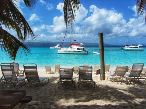 On the beach, sun loungers, beach towels