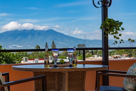 Shared roof patio has great view of lake, mountains and sunset.