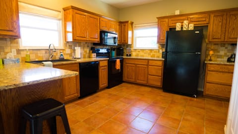 Granite counters, breakfast bar, dishwasher, oven, microwave, Kuerig and more.