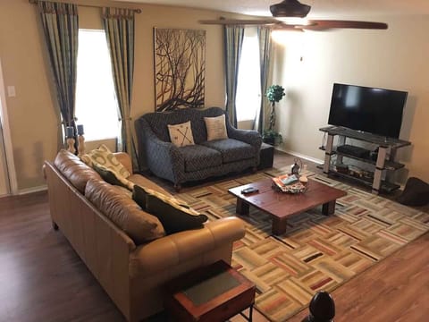 Living room. Relax and enjoy at the sofa with wifi and 50 inches TV with cable.