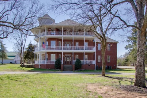 This Southern beauty has nine bedrooms, 7 full and 2 half baths & two fun acres.