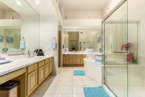 En-suite bath in bdrm 1: 2 separate vanities, shower and tub