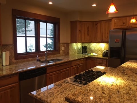Granite counters, gas cook top and stainless appliances