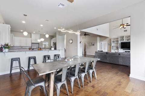 Large Metal Farm table that seats 10 with four additional barstools.