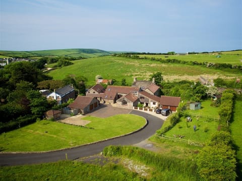 The Old Dairy is appx half of this farm building and owns the gardens on right.