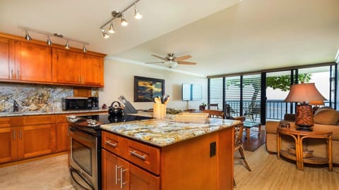 Updated open concept Kitchen that is well equipped w/ views of the beach 