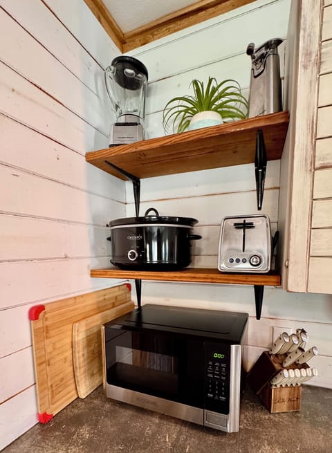 Kitchen appliances: blender, can opener, Crockpot, toaster and microwave