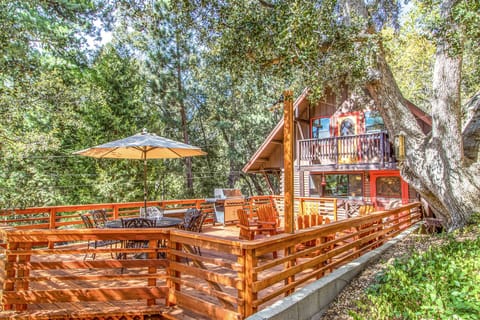 Large redwood deck, propane BBQ, table & chairs with umbrella, lounge chairs.