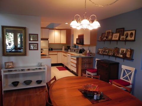 Dining room opens to a well furnished kitchen with lots of storage space.