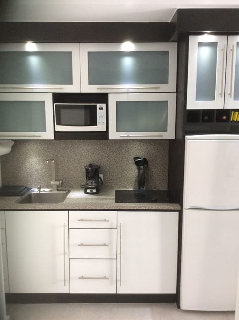 Fridge, microwave, stovetop, coffee/tea maker