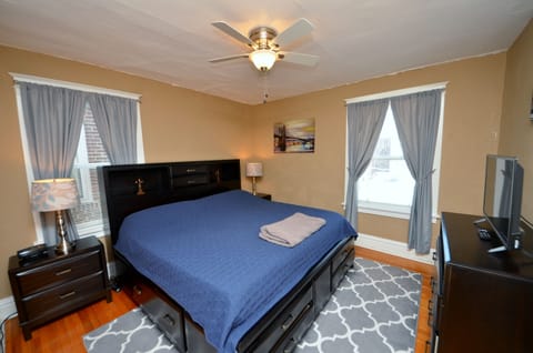 Bedroom With King Sized Bed And 32" Vizio Smart TV